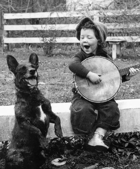 boy-playing-banjo-and-dog